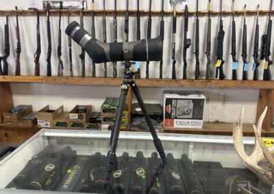 Leopold Scope on a Tripod in Firearm Shop