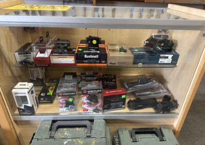 Firearms & Accessories in Glass Case