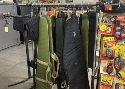 Gun cases hanging on a rack