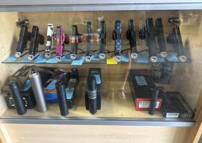 Firearms & Accessories in Glass Case